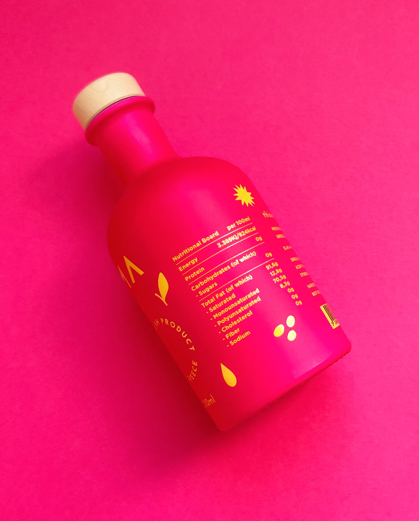 Nutritional Board of Vendema Extra Virgin Olive Oil Small Bottle in Pink Background.