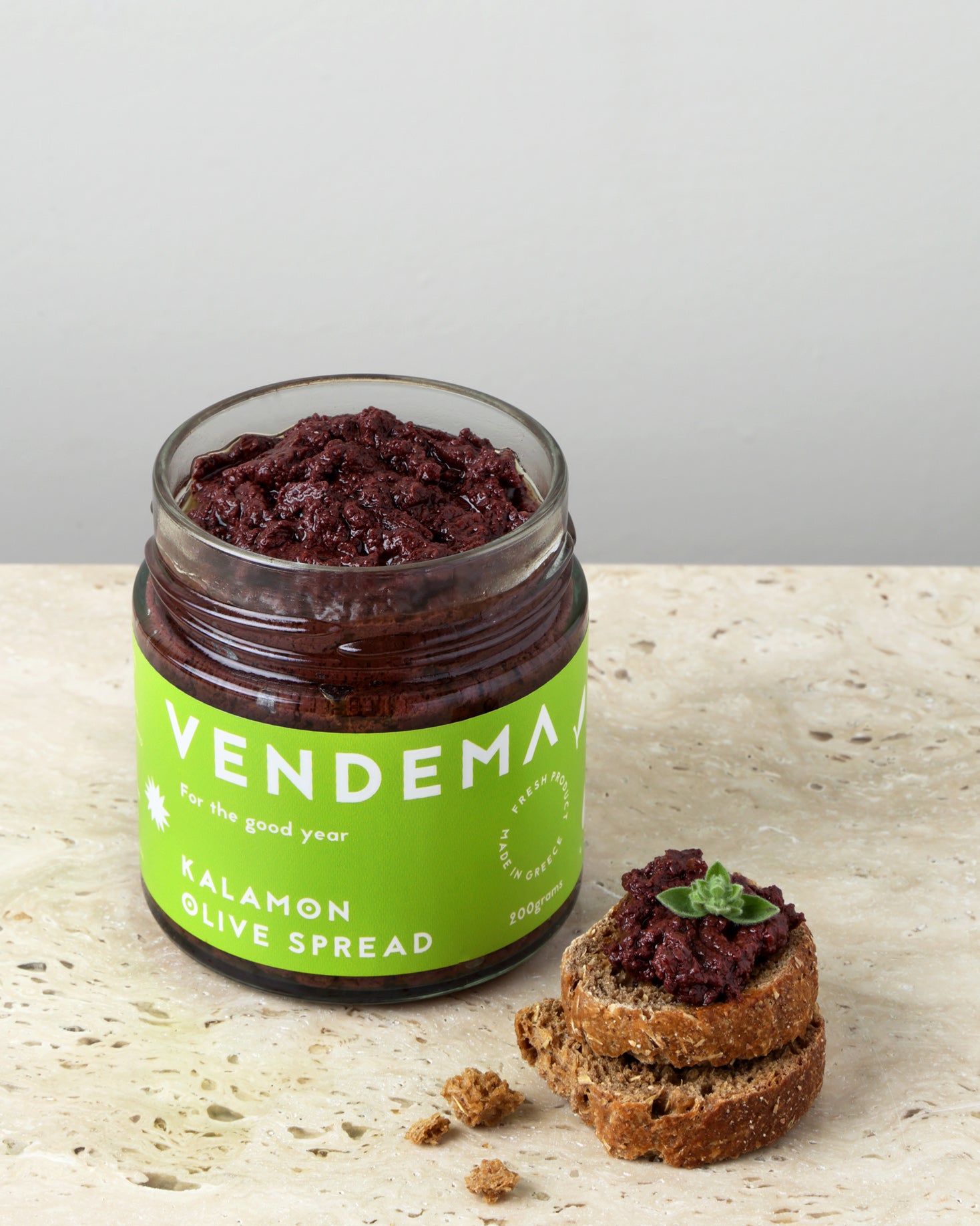 Open Vase of Vendema Kalamon Olive Spread with Complimentary Rusks.
