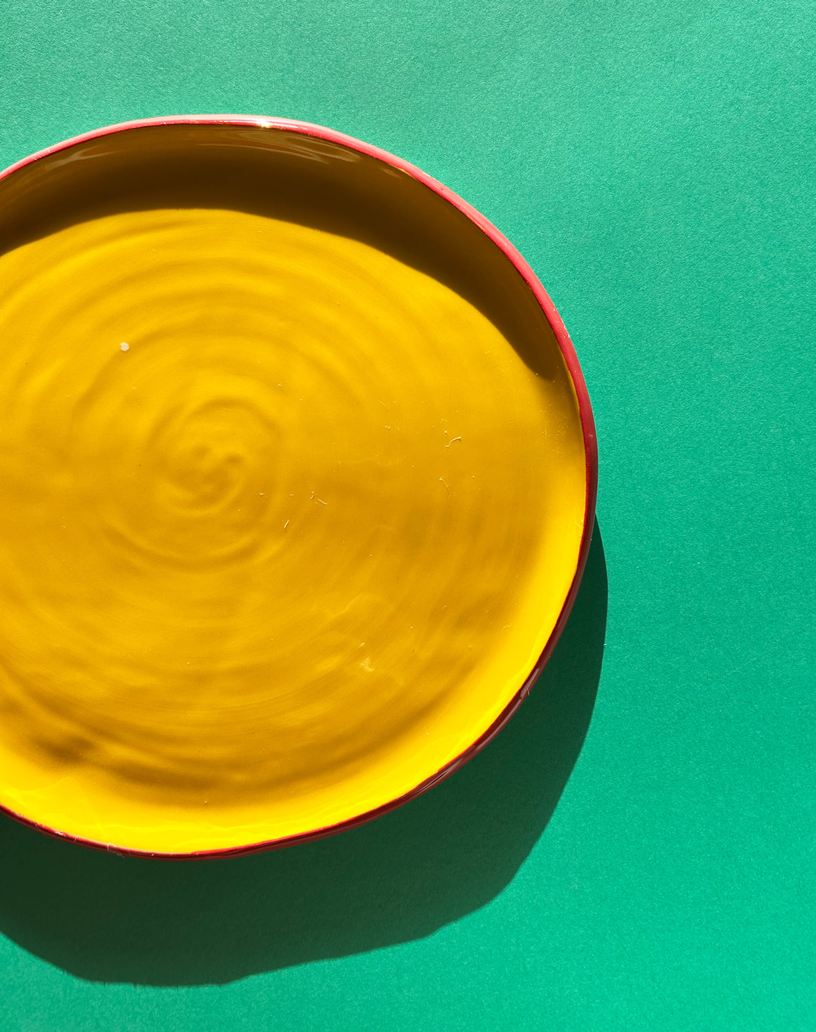 View from above of yellow ceramic salad plate.